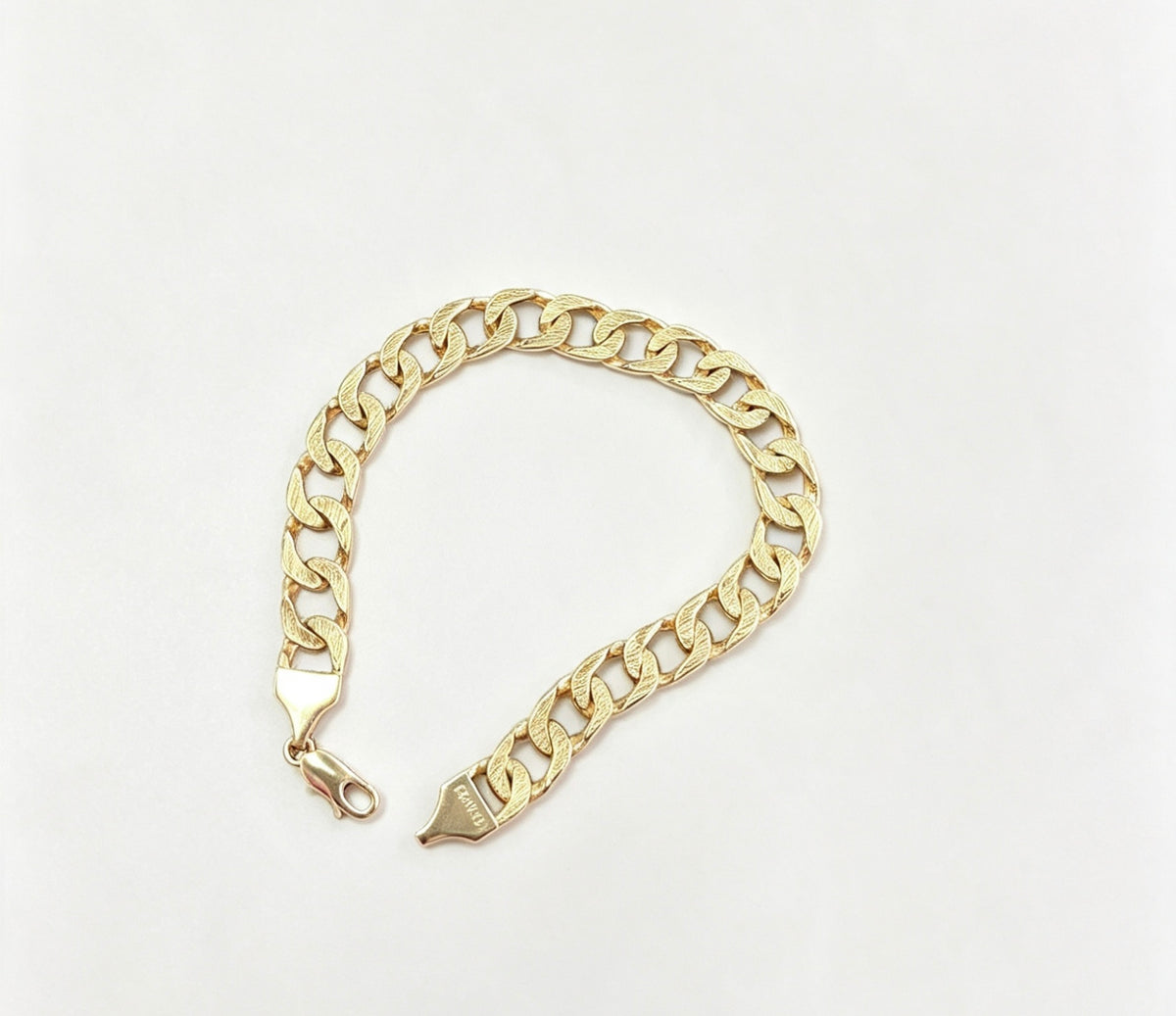 9ct gold gents  barked bracelet